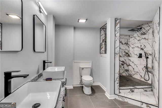 bathroom featuring tiled shower, vanity, and toilet