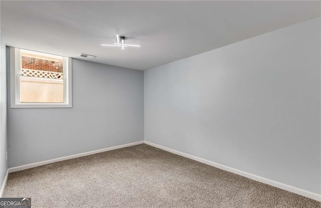 empty room featuring carpet flooring