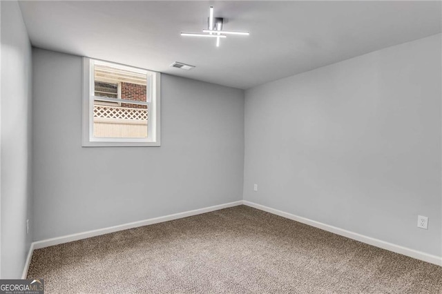 unfurnished room featuring carpet flooring