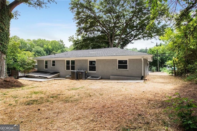 back of house featuring central AC and a patio area