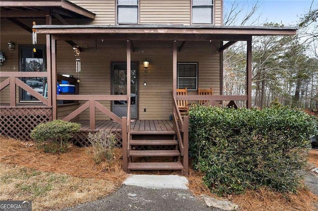 property entrance featuring a porch