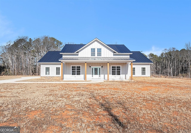 modern farmhouse style home featuring a porch