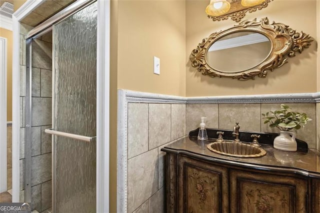 bathroom with vanity and an enclosed shower