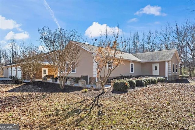 view of side of property with a garage