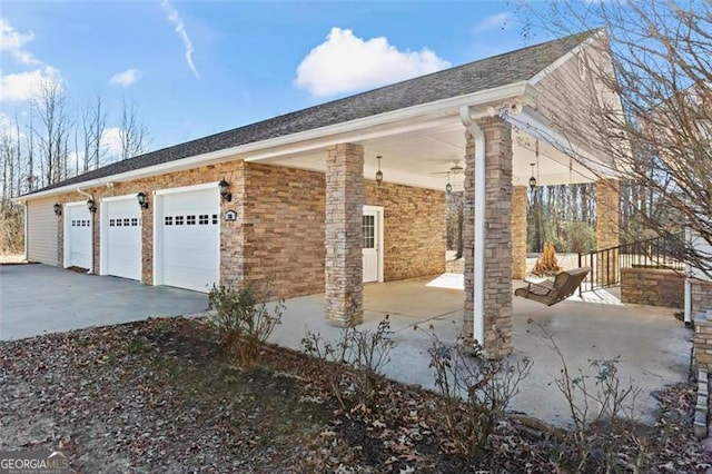 view of side of home featuring a garage