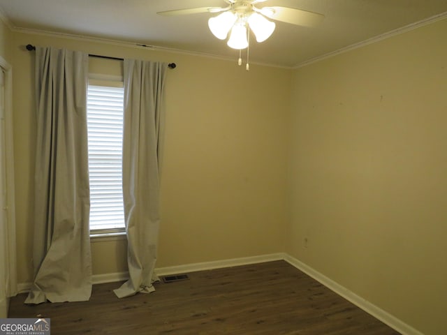 unfurnished room featuring ceiling fan, ornamental molding, and dark hardwood / wood-style floors