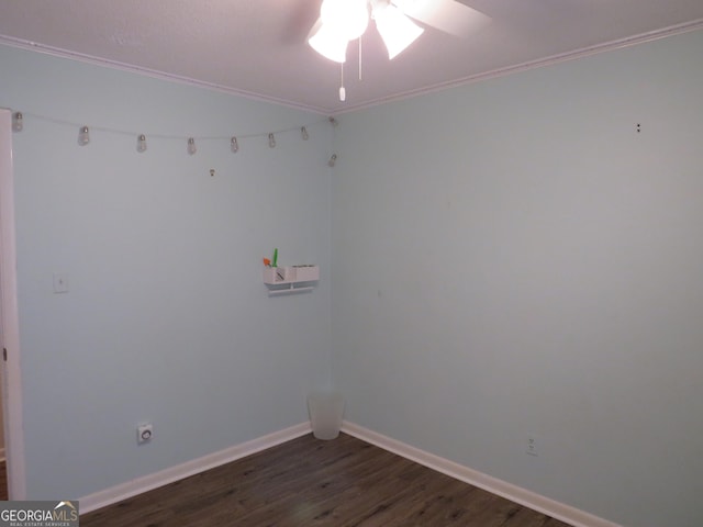 empty room featuring crown molding, dark hardwood / wood-style floors, and ceiling fan