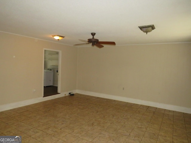 spare room with ceiling fan and washer / clothes dryer