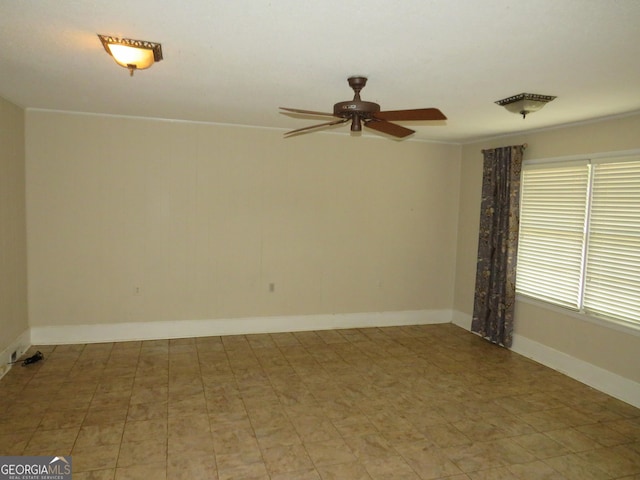 unfurnished room with ceiling fan