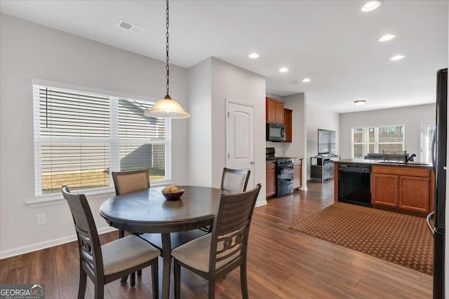 dining room with dark wood-type flooring