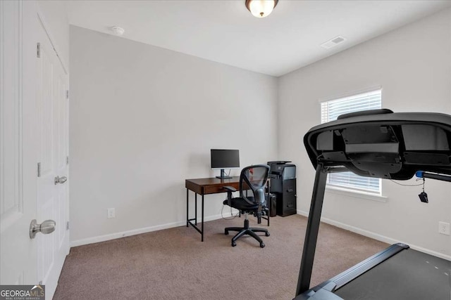 office area with light colored carpet and a healthy amount of sunlight