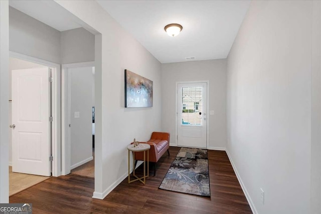 entryway with dark hardwood / wood-style floors