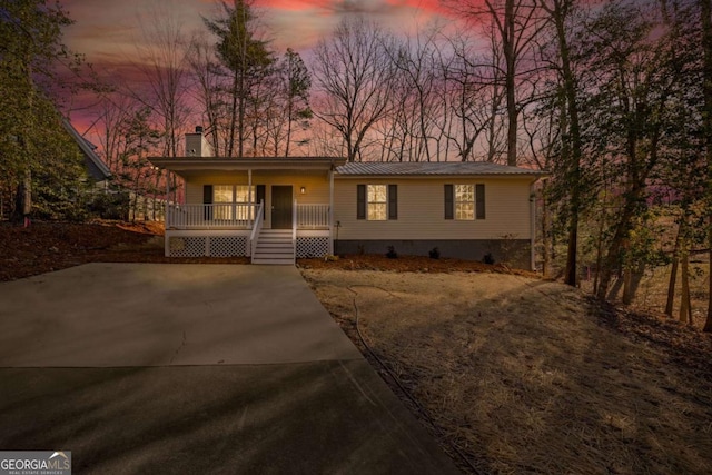 single story home featuring covered porch