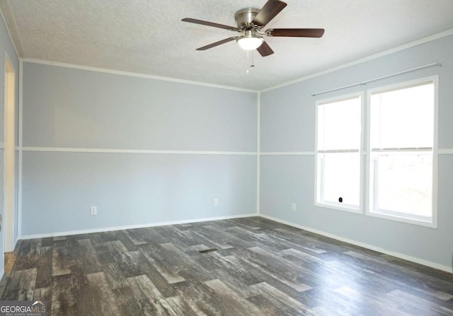 empty room featuring dark wood-type flooring, ornamental molding, and a textured ceiling