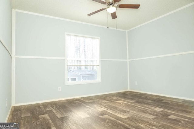 spare room with crown molding, ceiling fan, and dark hardwood / wood-style flooring