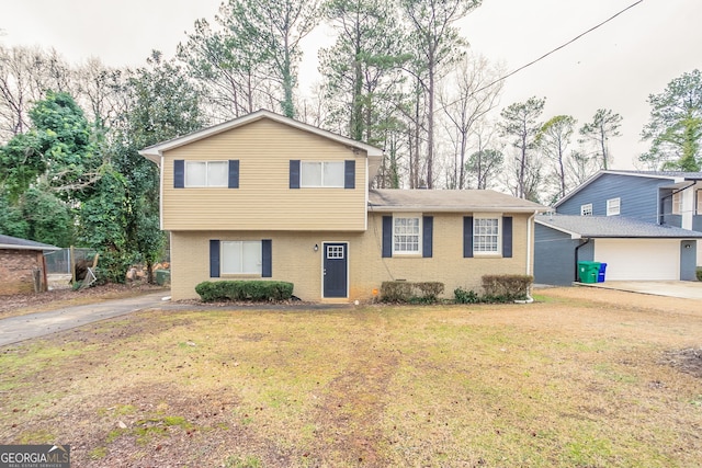 tri-level home with a front lawn