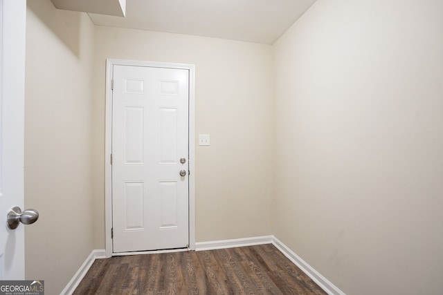 doorway with dark hardwood / wood-style flooring