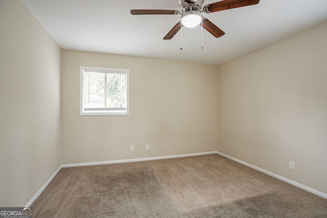 empty room with carpet floors and ceiling fan