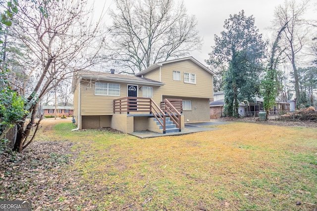 rear view of property with a lawn