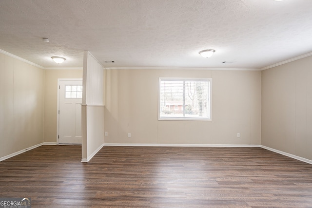 unfurnished room with crown molding, dark hardwood / wood-style floors, and a textured ceiling