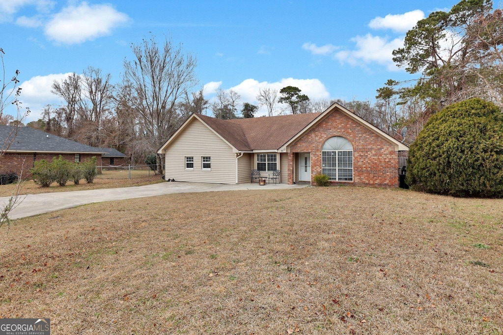 ranch-style house with a front lawn