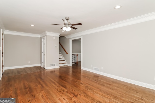 unfurnished room with crown molding, hardwood / wood-style floors, and ceiling fan