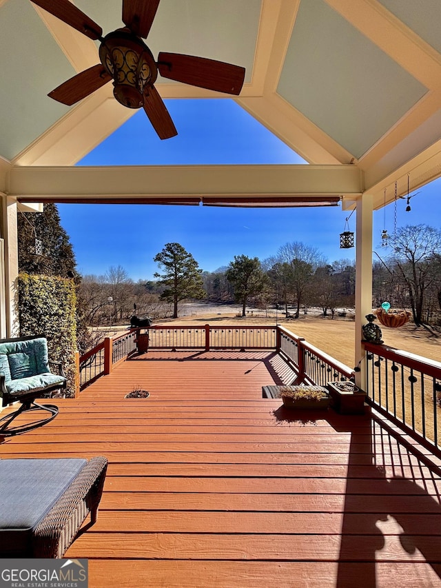 wooden terrace featuring ceiling fan