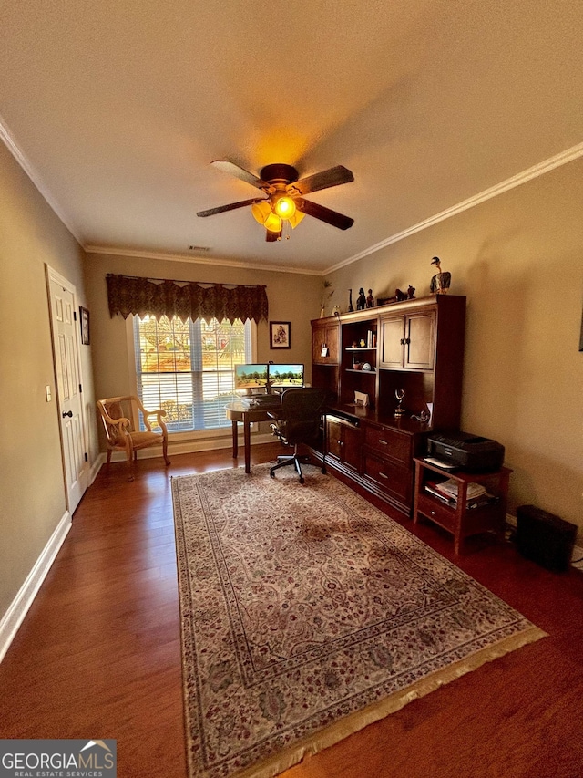 home office featuring dark wood-type flooring, ceiling fan, and ornamental molding