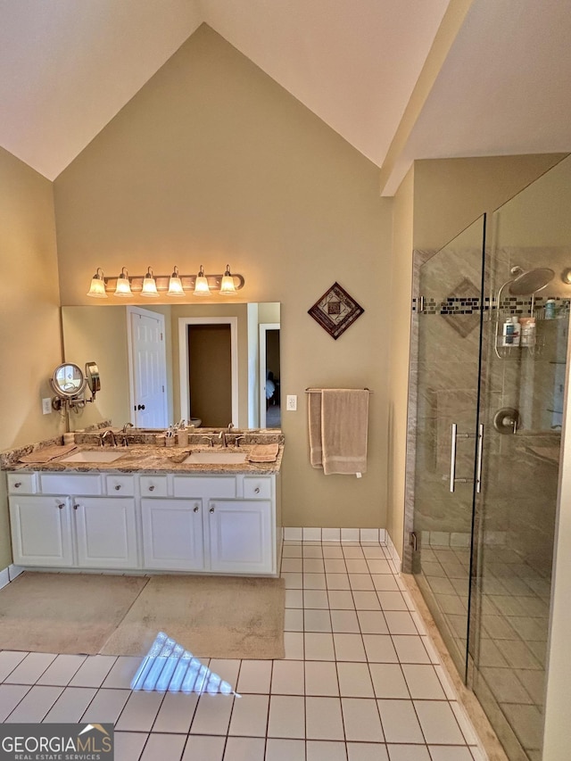 bathroom featuring an enclosed shower, vanity, tile patterned floors, and high vaulted ceiling