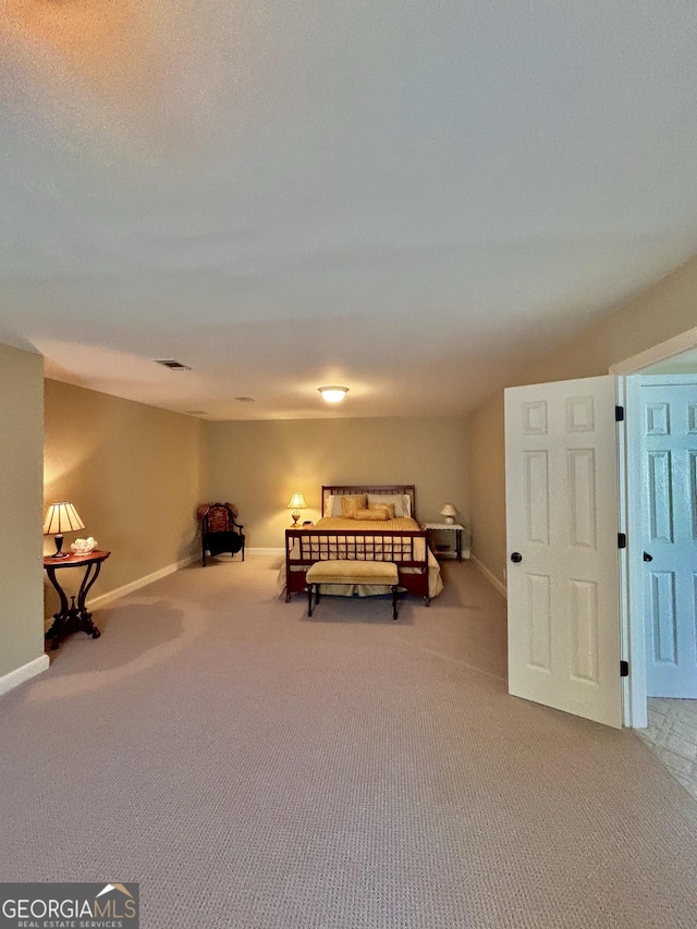 bedroom featuring light colored carpet