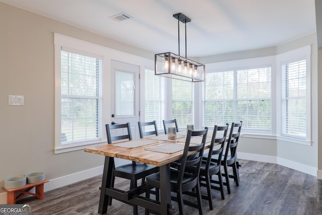 dining room featuring dark hardwood / wood-style flooring