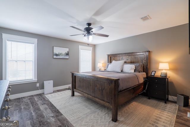 bedroom with ceiling fan and hardwood / wood-style floors