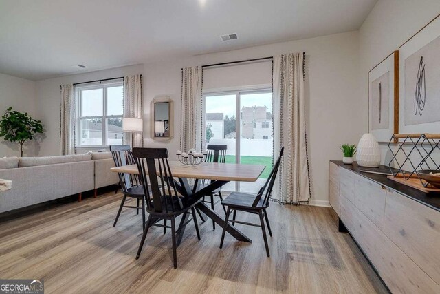 dining room featuring light hardwood / wood-style flooring