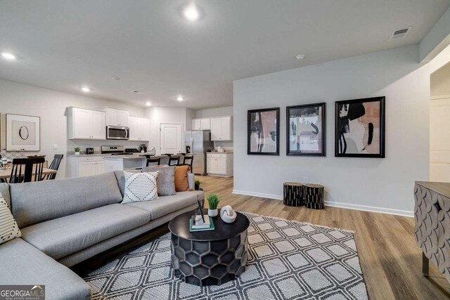 living room featuring light hardwood / wood-style floors