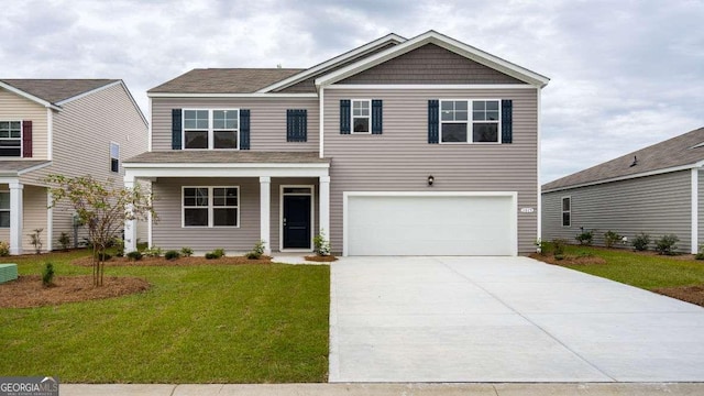 view of front of home with a garage and a front yard