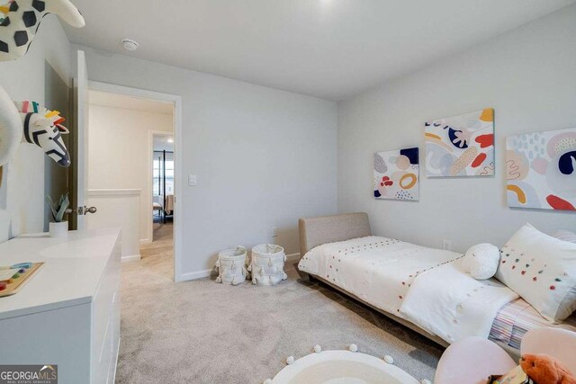 bedroom featuring light colored carpet