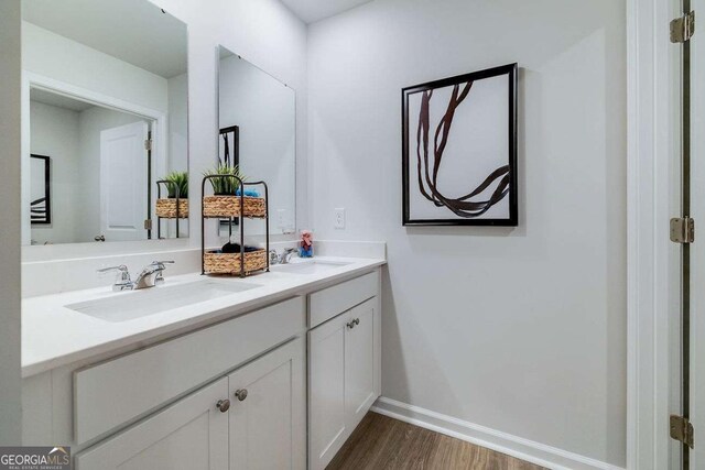 bathroom featuring vanity and hardwood / wood-style floors