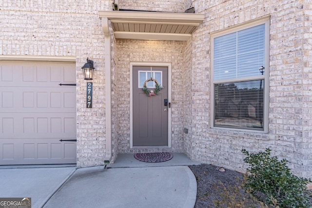 view of exterior entry featuring a garage