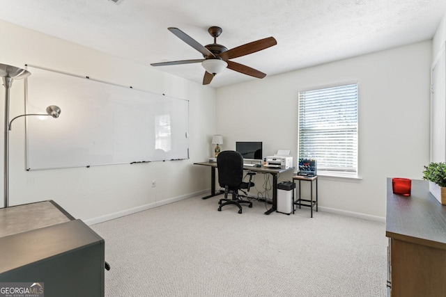 home office with ceiling fan and light colored carpet