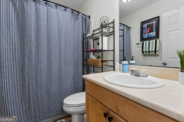 bathroom with vanity and toilet