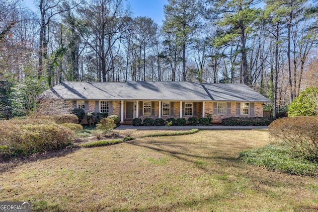 ranch-style house with a front yard