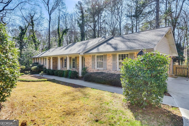 ranch-style house with a front lawn