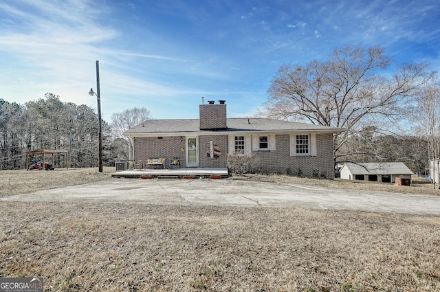 1202 Franklin Rd SW, Plainville, GA 30733 - ranch-style home featuring brick siding, a chimney, and a deck