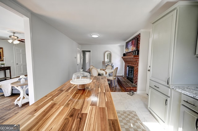 1202 Franklin Rd SW, Plainville, GA 30733 - living area featuring a fireplace and a ceiling fan