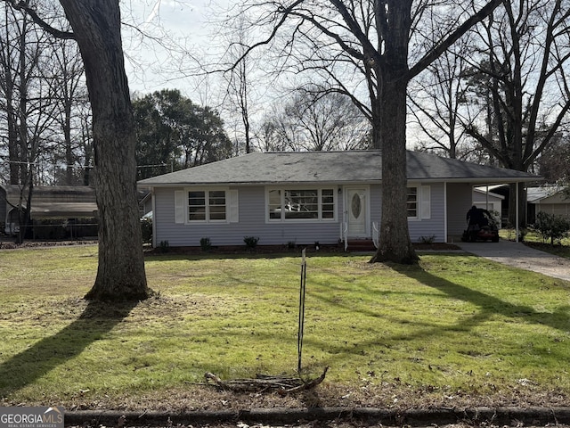 ranch-style home with a carport and a front lawn