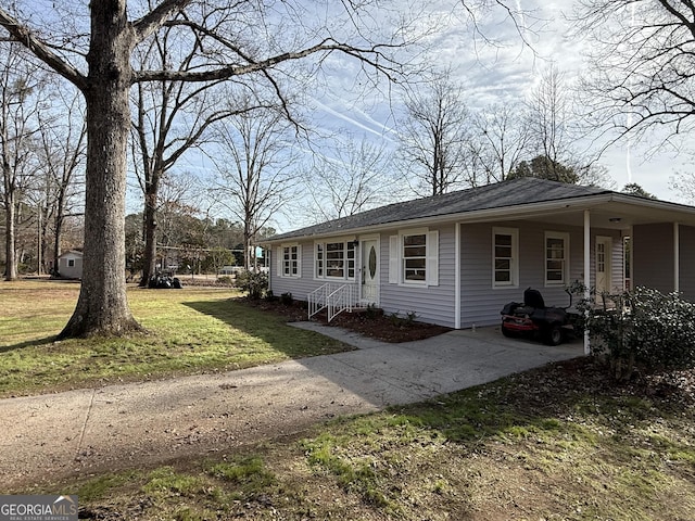 view of side of property with a yard