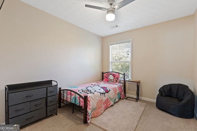 carpeted bedroom featuring ceiling fan