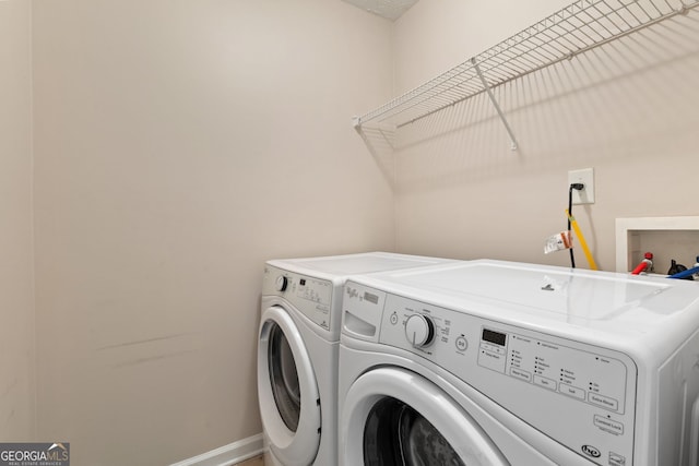 laundry room with washing machine and dryer