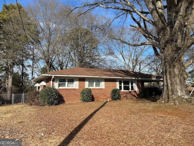 single story home featuring a carport