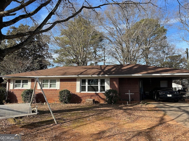 view of front of home featuring a carport